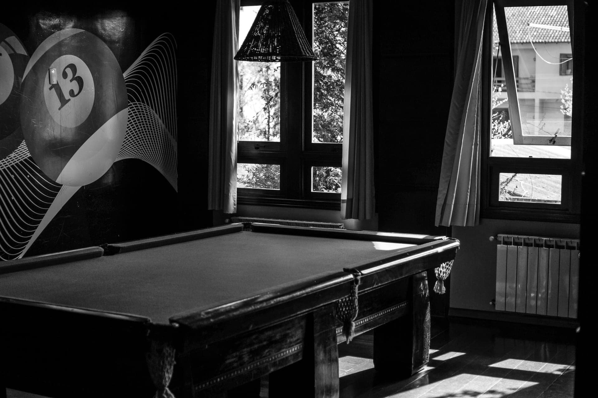 A slate pool table with a solid wood frame